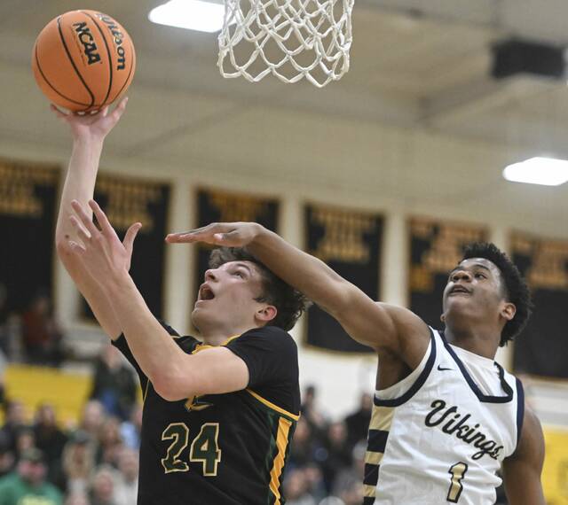 Deer Lakes’ Evan Moore scores past Hopewell’s Tre Cameron during the WPIAL 4A quarter final Wednesday Feb. 17, 2026 at North Allegheny High School. (Chaz Palla | TribLive)