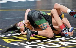 Derrys Patrick Bulger beats Trinitys Camron Smith at 114 pounds during a first-round match at the PIAA Class 2A wrestling championships Thursday at Hersheys Giant Center. (Chaz Palla | TribLive)