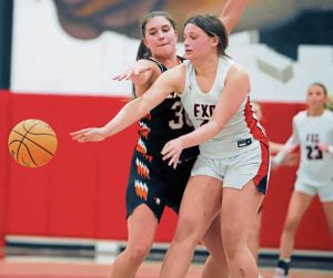 Fox Chapels Isabella Geller attempts to pass the ball around the reach of Latrobes Maggie Maiers during the final two minutes of a WPIAL Class 5A playoff game Feb. 13 at Fox Chapel. (Josh Rizzo | For TribLive)
