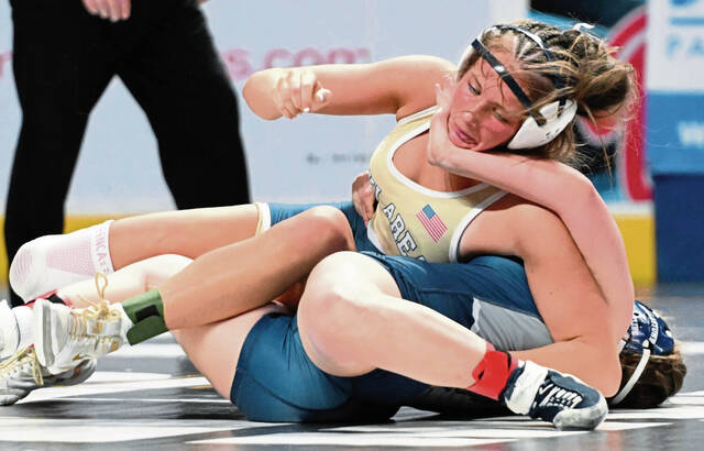 Kiski Areas Ava Golding beats Dallastowns Avery Baldwin during a PIAA girls 142-pound quarterfinal bout Friday at Giant Center. (Chaz Palla | TribLive)