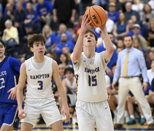 Hampton’s Jonas Cupps scores next to Luca Romero Lauro during their PIAA Class 5A first round state playoff game on Friday, Mar. 6, 2026, at Hampton. (Christopher Horner | TribLive)