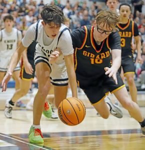 Knoch's Vinnie DeFelice (left) and Girard's Tyler Niewierowski go for a loose ball Friday night during the first round of the PIAA Class 4A playoffs at Knoch. (Josh Rizzo | For TribLive)