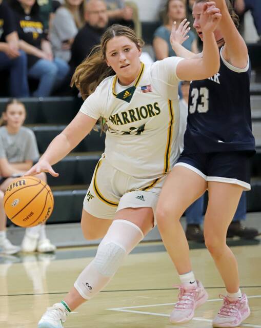 Penn-Traffords Torrie DeStefano heads toward the rim past West Yorks Brooke Nalls during a PIAA Class 5A playoff game Saturday. (Josh Rizzo | For TribLive)