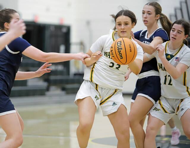 Penn-Traffords Brooke Boss pulls in an offensive rebound after following her own miss during a PIAA Class 5A playoff game Saturday. (Josh Rizzo | For TribLive)