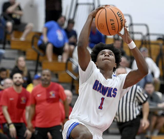 Jeannette’s Kymon’e Brown scores against Northern Cambria during their PIAA Class 2A first round state playoff game on Saturday, Mar. 7, 2026, at Jeannette. (Christopher Horner | TribLive)