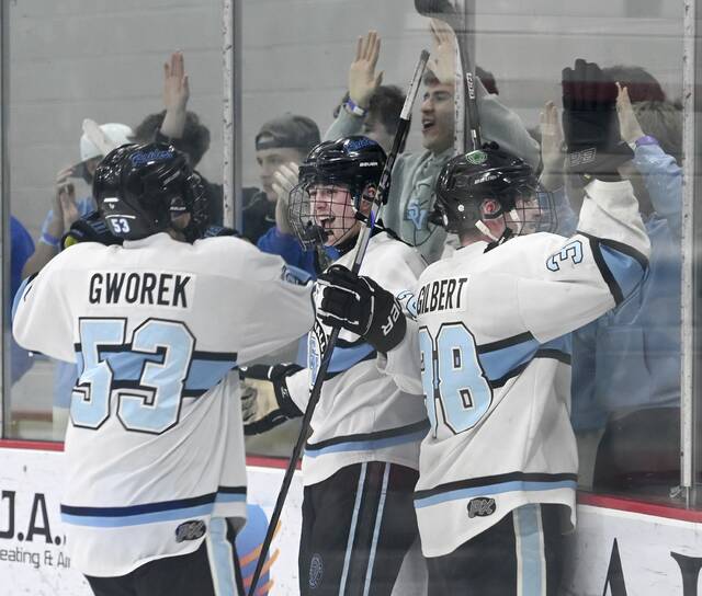 Seneca Valley’s CJ Gworek celebrates with Tyler Maxwell Jacob Gilbert after defeating Pine-Richland, 2-1, in their Class 3A Penguins Cup semifinal on Monday, Mar. 9, 2026, at RMU. (Christopher Horner | TribLive)