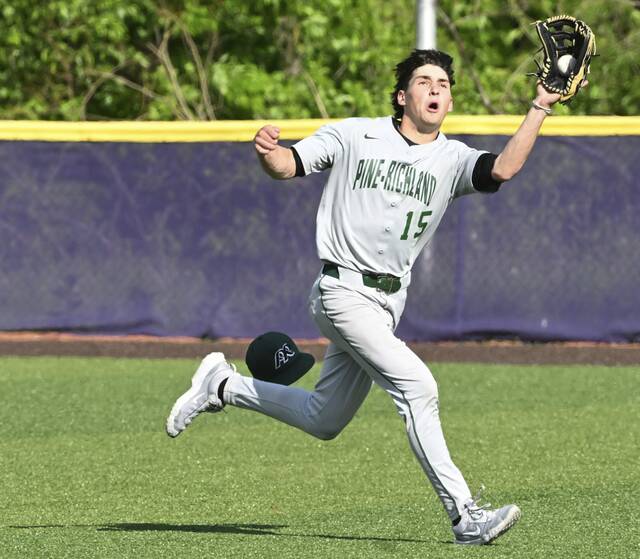 Pine-Richlands Drew Boivin tracks down a ball hit by Latrobes Andrew Hantz during the WPIAL Class 5A quarterfinals last season. (Chaz Palla | TribLive)