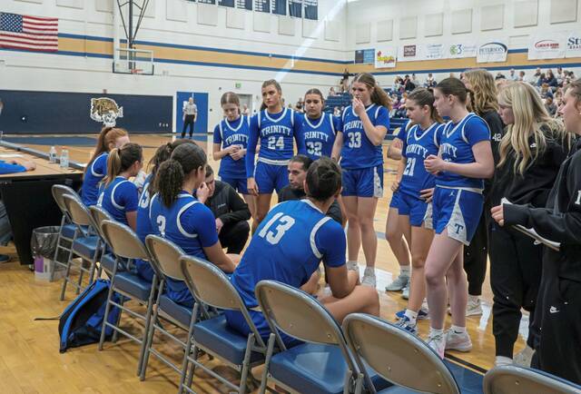 The trinity girls basketball team huddles up. (Submitted | Nikki Rieg)