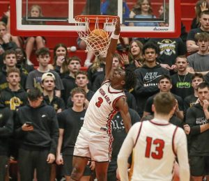 Moon's AJ Buford dunks against Thomas Jefferson in the PIAA Class 5A second round Tuesday, March 10, 2026 at Peters Township. (Mike Darnay | Mon Valley Independent)