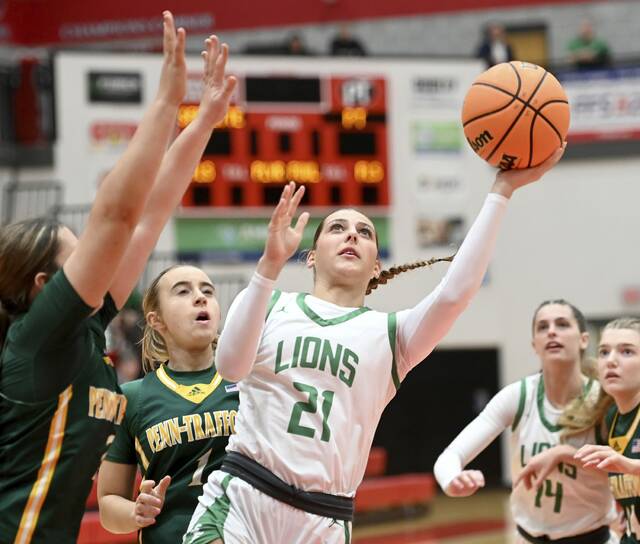 South Fayettes Ella Vierra scores through Penn-Trafford defenders during their PIAA Class 5A playoff game Wednesday. (Christopher Horner | TribLive)