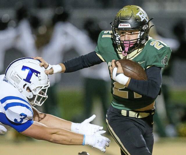 Belle Vernons Chace Petrosky stiff-arms Trinitys Anthony Giorgi in October. (Mike Darnay | Mon Valley Independent)