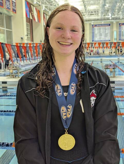 Fox Chapel freshman Ellie Lange is all smiles after winning the Class 3A girls 200-yard individual medley Wednesday, March 11, 2026 at the PIAA swimming championships at Bucknell University. (Michael Love | TribLive)