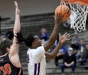 Obama Academys Eric James scores past Cathedral Preps Michael Thompson during their PIAA Class 4A playoff game on Tuesday, March 10, 2026, at Sharon High School. (Christopher Horner | TribLive)