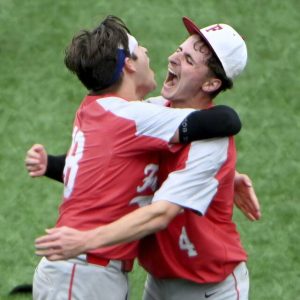 Freedoms Nick Fessler celebrates with Boden Hillard after defeating OLSH in the WPIAL Class 2A championship game on May 28, 2025, at EQT Park. (Christopher Horner | TribLive)