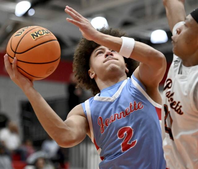 Jeannettes Jayce Powell drives to the basket against Jefferson-Morgan during their PIAA Class 2A playoff game on Wednesday, March 11, 2026, at Peters. (Christopher Horner | TribLive)