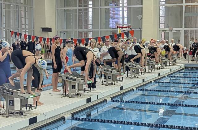 Swimmers take the blocks for the start of the 400-yard relay at the PIAA Class 3A swimming championships March 12, 2026, at Bucknell University. (Michael Love | TribLive)