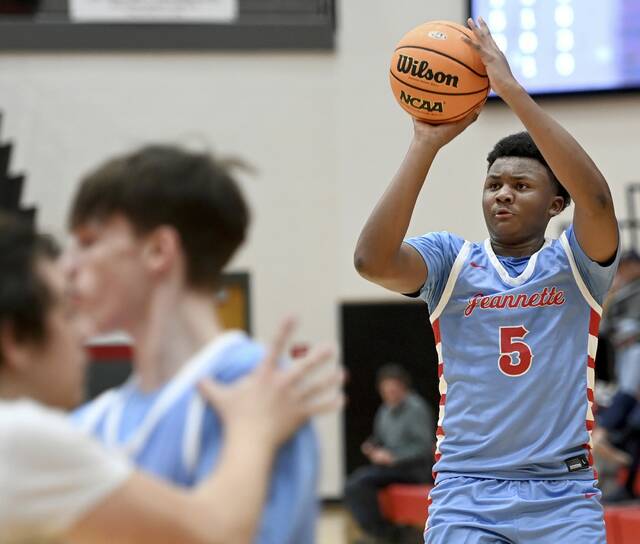 Jeannettes Markus McGowan shoots a 3-pointer against Jefferson Morgan during their PIAA Class 2A playoff game Wednesday. (Christopher Horner | TribLive)