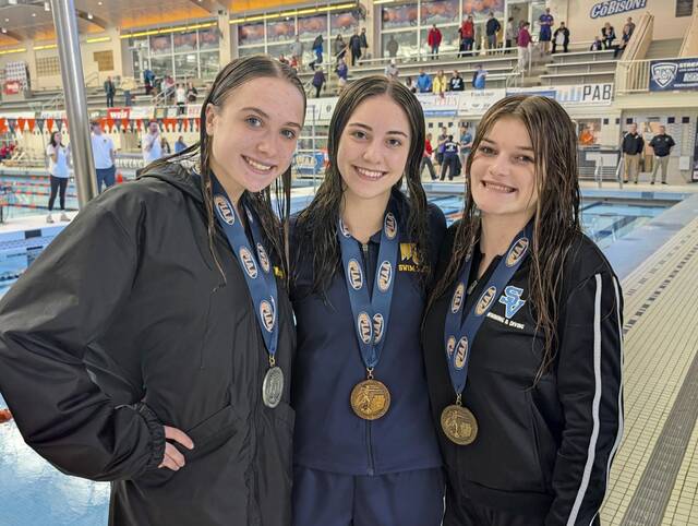 WPIAL medalists at the PIAA Class 3A girls diving championships on March 12, 2026, at Bucknell, included, from left, North Allegheny's Maggie Lapina (second), Mars' Marin Raible (third) and Seneca Valley's Ali Waters (fourth). (Michael Love | TribLive)