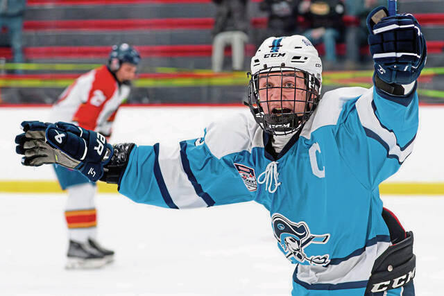 Burrells Dante Taliani reacts following the winning goal in overtime of the PIHL Division 2 semifinals Thursday at the RMU Island Sports Center. (Andrew Palla | For TribLive)
