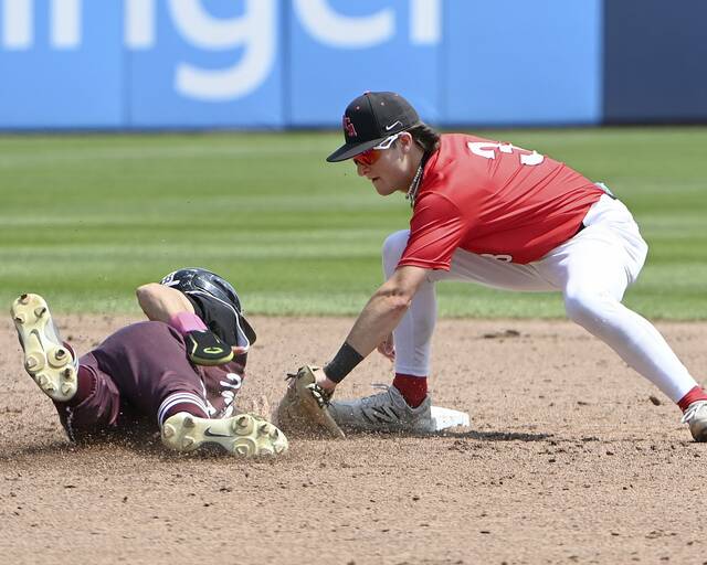 Eden Christian Academys Brett Feldman tags out Southern Fultons Joel Fitz at second base during the PIAA Class A state championship game on Thursday, June 12, 2025, at Penn State. (Christopher Horner | TribLive)