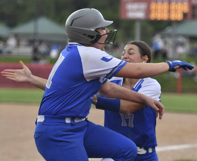 Unions Irelyn Fisher celebrates with Olivia Benedict after Benedict scored the game-winning run against Carmichaels during the WPIAL Class A championships May 29, 2025 at Lilley Field. (Chaz Palla | TribLive)
