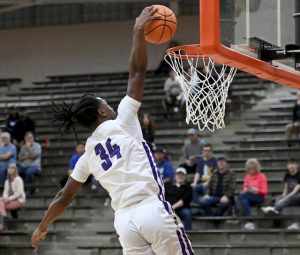 Obama Academys Eric James dunks against Cathedral Prep during their PIAA Class 4A playoff game Tuesday at Sharon High School. (Christopher Horner | TribLive)