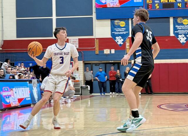 Chartiers Valleys Logan Helfrick looks to pass against Exeter Township in the PIAA Class 5A first round March 6. (Antonio Rossetti | For TribLive)