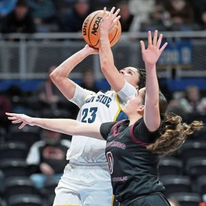 Shady Side Academys Karis Thomas scores past Greensburg Central Catholics Morgan Skoloda during the WPIAL Class 3A championship game Feb. 26. (Christopher Horner | TribLive)