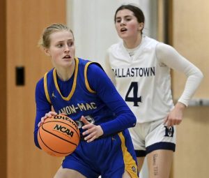 Canon-McMillan’s Faye Saunders works against Dallstown’s Olivia Cleaver during their PIAA Class 6A state quarterfinal on Friday, Mar. 13, 2026, at Altoona. (Christopher Horner | TribLive)