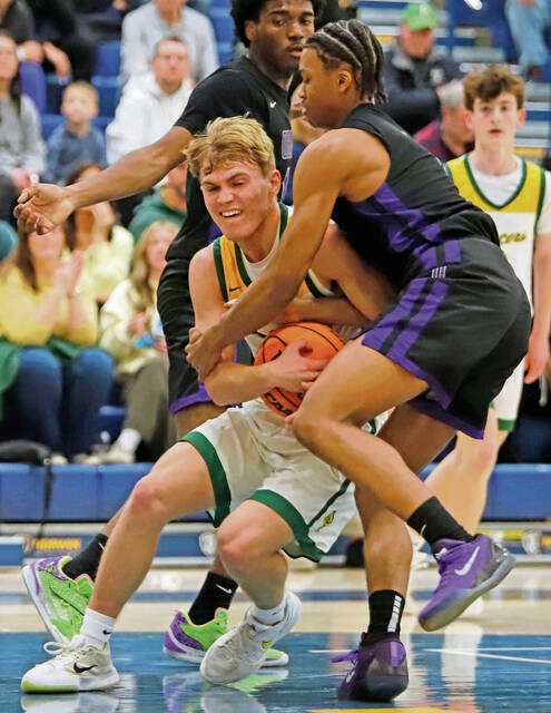 Collin Rodgers fights for the ball with Obama Academys Jaden Colbert during a PIAA Class 5A quarterfinal Friday. (Josh Rizzo | For TribLive)