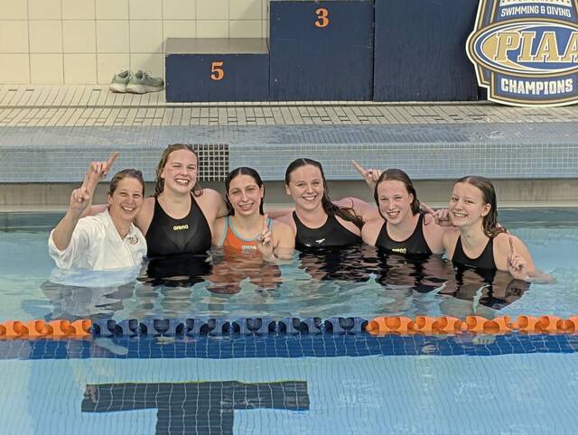 Shady Side Academy swimmers in the pool after taking the plunge to celebrate winning the PIAA Class 2A girls team title Saturday, March 14, 2026 Bucknell University. (Michael Love | TribLive)