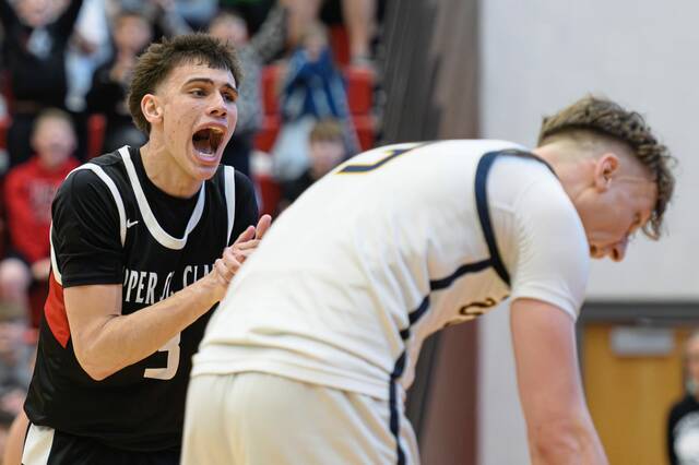 Upper St. Clair's Jake Foster (back) reacts after pressuring Central Catholic's Enzo Khalil (front) into committing a turnover in the PIAA quarterfinals Saturday, March 14, 2026, at Peters Township. (Andrew Palla | For TribLive)