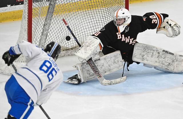 Hempfields Nick Crupie beats Bethel Park goaltender Kevin Teaman during the PIHL Class 2A Penguins Cup semifinals Tuesday. (Chaz Palla | TribLive)