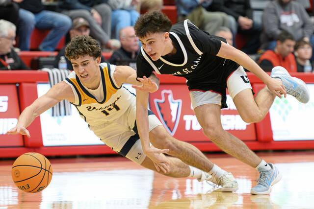 Upper St. Clair's Jake Foster (3) and Central Catholic's Christian Williams (14) race to a loose ball in the PIAA quarterfinals Saturday, March 14, 2026, at Peters Township. (Andrew Palla | For TribLive)