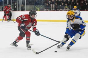 Avonworth's Jack Sutch (92) lugs the puck into the offensive zone amidst pressure from Canon-McMillan's Connor Stokes (42) in the PIHL Class A semifinals Wednesday, March 11, 2026, at the RMU Island Sports Center. (Andrew Palla | For TribLive)