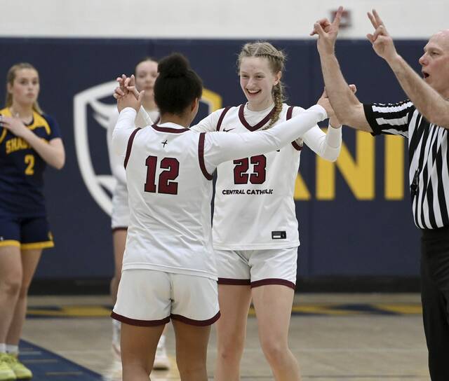 Greensburg Centrals Erica Gribble celebrates with Jayla Peterson, as they exit the game late in the fourth quarter of their PIAA Class 3A state semifinal against Shady Side Academy on Monday, Mar. 16, 2026, at Norwin. (Christopher Horner | TribLive)