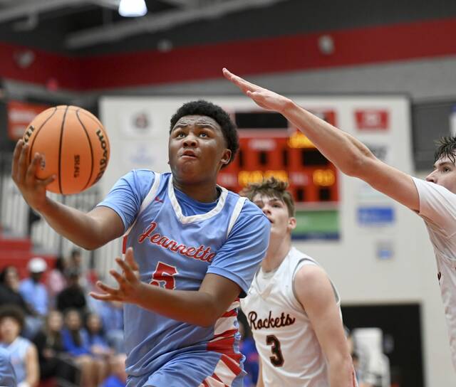 Jeannette’s Markus McGowan scores past Jefferson Morgan defenders during their PIAA Class 2A state playoff game on Wednesday, Mar. 11, 2026, at Peters. (Christopher Horner | TribLive)