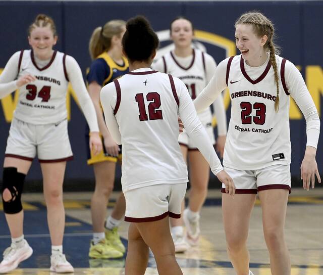 Greensburg Centrals Erica Gribble celebrates with Jayla Peterson as they exit the game late in the fourth quarter of their PIAA Class 3A semifinal against Shady Side Academy on Monday at Norwin. (Christopher Horner | TribLive)