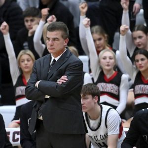 Upper St. Clair coach Danny Holzer watches from the bench during a game against Norwin on Dec. 9, 2025. (Christopher Horner | TribLive)