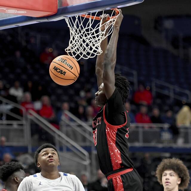 Sewickley Academys Adam Ikamba dunks against Jeannette during the WPIAL Class 2A championship game Feb. 27 at Petersen Events Center. (Christopher Horner | TribLive)