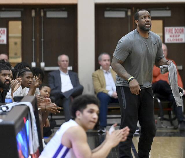 Obama Academy coach Naron Jackson reacts from the bench during the Eagles PIAA Class 4A playoff game against Cathedral Prep on March 10 at Sharon High School. (Christopher Horner | TribLive)