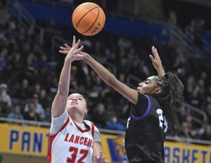 Neshannocks Payton Newman scores past Winchester Thurstons DaShae Cochran during the WPIAL Class 2A girls basketball championship game Feb. 28 at Petersen Events Center. (Chaz Palla | TribLive)