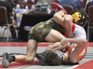 Penn-Traffords Dylan Barrett wrestles Hazleton Areas Gabe Benyo during a PIAA Class 3A 114-pound quarterfinal March 5 at Giant Center. (Chaz Palla | TribLive)