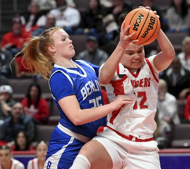 Neshannock’s Payton Newman grabs a rebound next to Berlin Brothersvalley’s Penny Stoltzfus during the PIAA Class 2A state championship game on Thursday, Mar. 19, 2026, at Giant Center in Hershey. (Christopher Horner | TribLive)