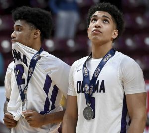 Obama Academy’s Elijah Rawlings (2) and Sean Gaines stand together after receiving their runner-up medals after the PIAA Class 4A state championship game against Devon Prep on Thursday, Mar. 19, 2026, at Giant Center in Hershey. (Christopher Horner | TribLive)