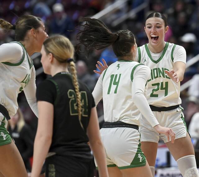 South Fayette’s Ryan Oldaker celebrates with Juliette Leroux as time expires in the PIAA Class 5A state championship game against Archbishop Wood on Saturday, Mar. 21, 2026, at Giant Center in Hershey. (Christopher Horner | TribLive)