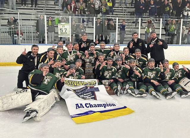 Penn-Trafford players and coaches celebrate their victory over North Penn in the state Class 2A hockey final Saturday. (Courtesy of Brian Zagorac)