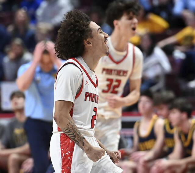 Sewickley Academys Caiden Battles celebrates after hitting a 3-pointer at the first quarter buzzer during the PIAA Class 2A championship game against Old Forge on Friday, March 20, 2026, at Giant Center in Hershey. (Christopher Horner | TribLive)