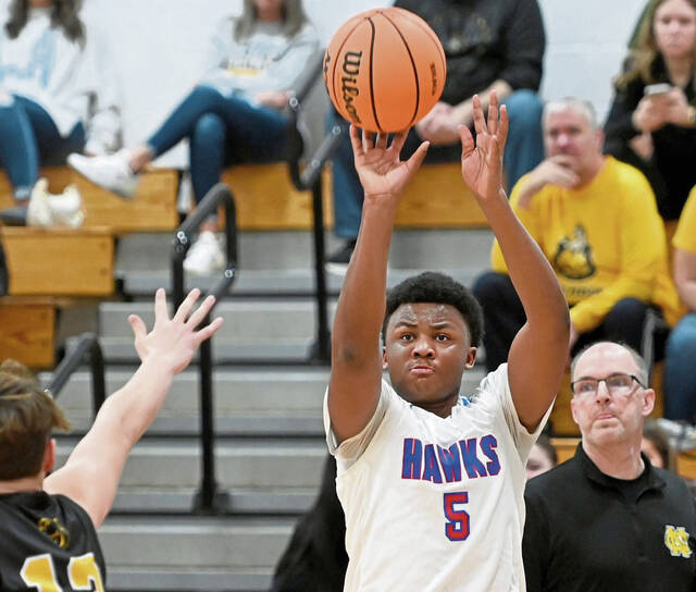 Jeannettes Markus McGowan shoots a 3-pointer against Northern Cambria during the PIAA Class 2A playoffs. (Christopher Horner | TribLive)