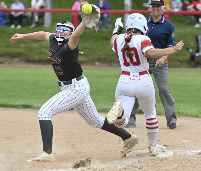 Neshannocks Brenna Frengel beats the throw to Chartiers-Houstons Seanna Riggle at first during the WPIAL Class 2A championship game last season. (Chaz Palla | TribLive)